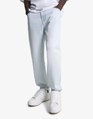 Джинсы свободного кроя, зауженные в нижней части- Заказать в России