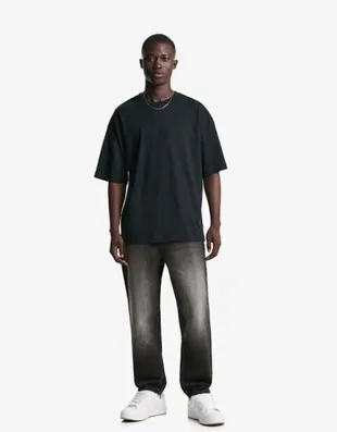 Джинсы свободного кроя, зауженные в нижней части- Заказать в России