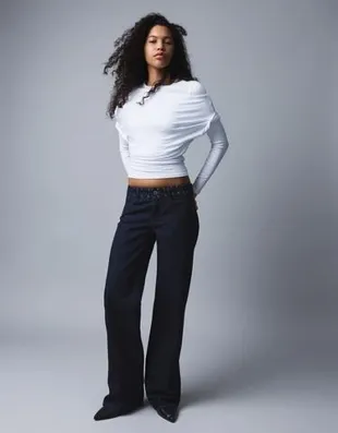 Джинсы свободного кроя с низкой посадкой и заклепками- Заказать в России