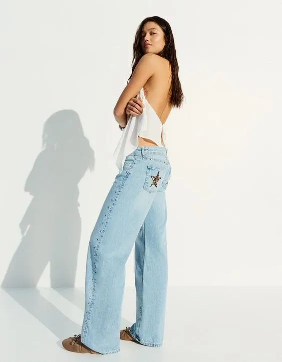 Джинсы свободного кроя с заклепками в виде звезд- Заказать в России