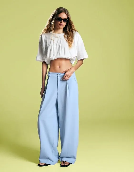 Брюки объемного кроя из двухслойной ткани- Заказать в России