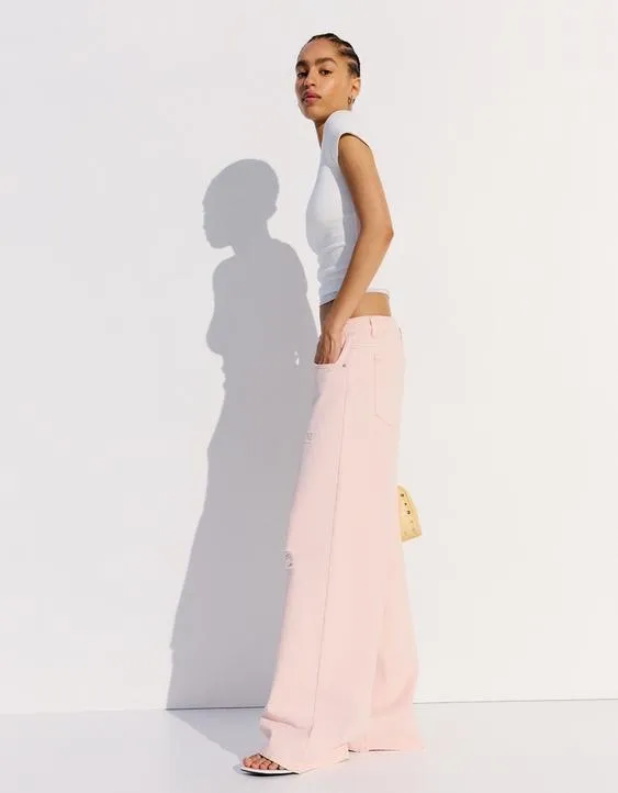 Брюки с эффектом потертости и разрезами- Заказать в России