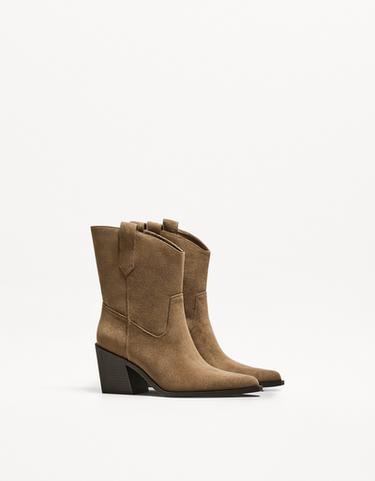 Asymmetric heeled cowboy ankle boots