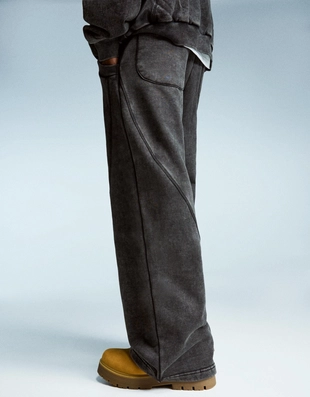 Объемные брюки свободного кроя с эффектом потертости- Заказать в России