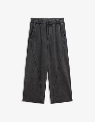 Объемные брюки свободного кроя с эффектом потертости- Заказать в России