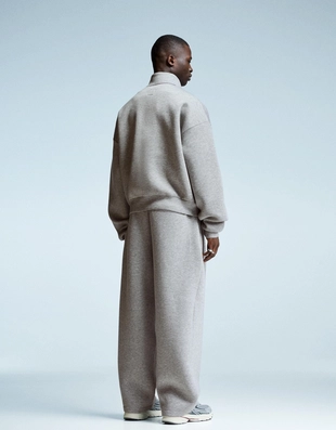 Брюки из высокотехнологичной ткани с защипами- Заказать в России