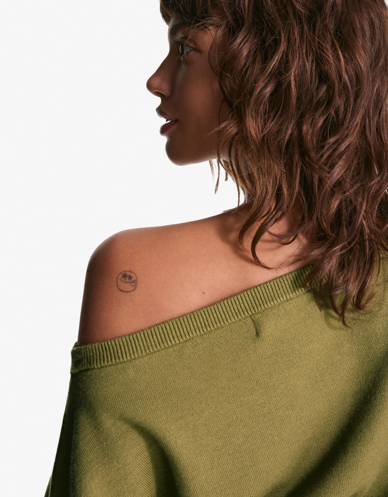 Асимметричный свитер с низом в рубчик