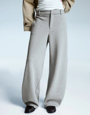 Брюки объемного кроя, зауженные книзу- Заказать в России