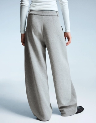 Брюки объемного кроя, зауженные книзу- Заказать в России