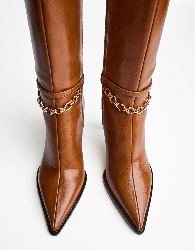 High-heel boots with watch detail