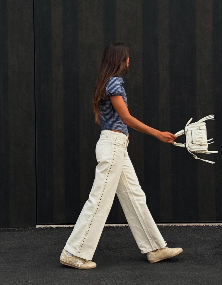 Брюки с прямыми штанинами, необработанными кромками и люверсами