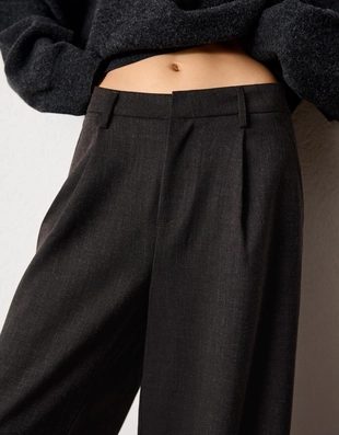 Брюки объемного кроя из двухслойной ткани- Заказать в России