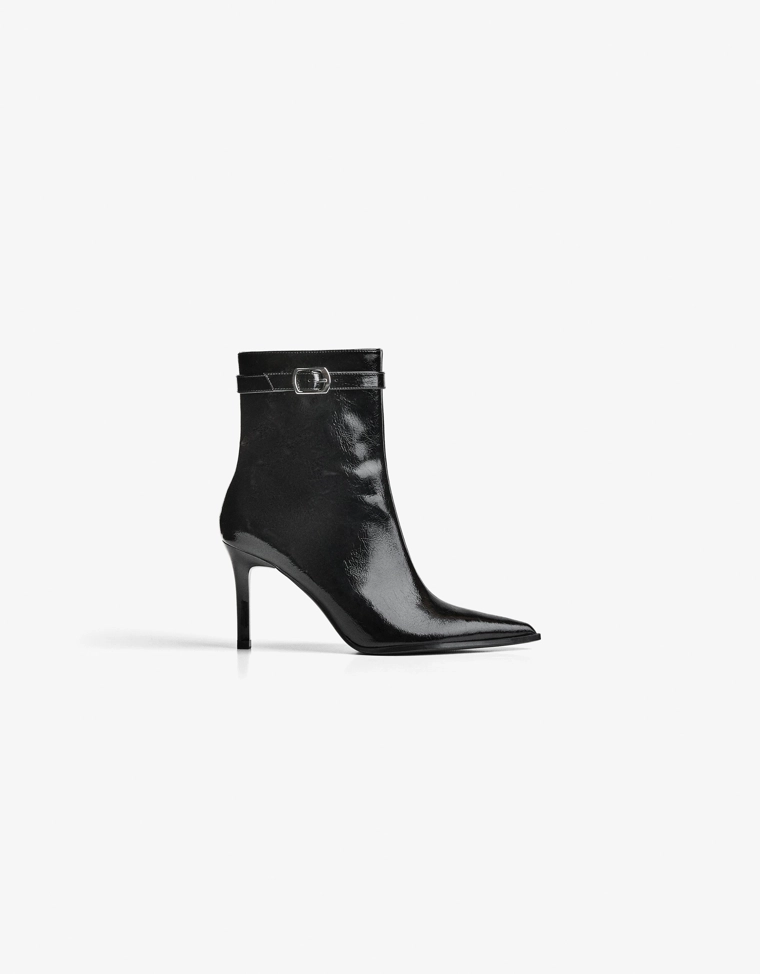 Heeled ankle boots with buckle strap