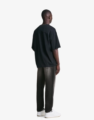 Джинсы свободного кроя, зауженные в нижней части- Заказать в России