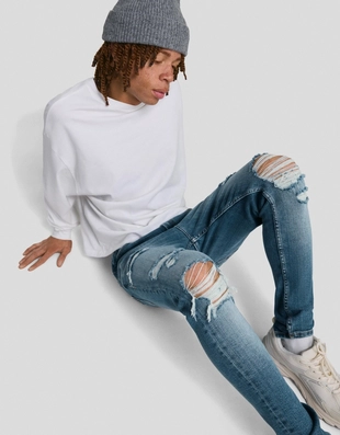 Джинсы суперскинни с разрезами- Заказать в России