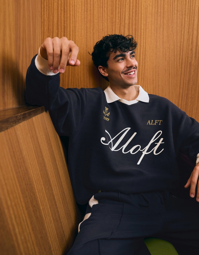 Поло геометрического кроя с длинными рукавами и принтом