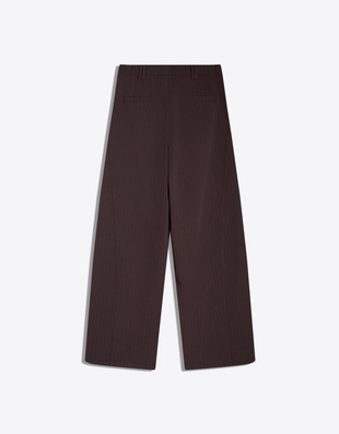 Брюки объемного кроя из двухслойной ткани- Заказать в России