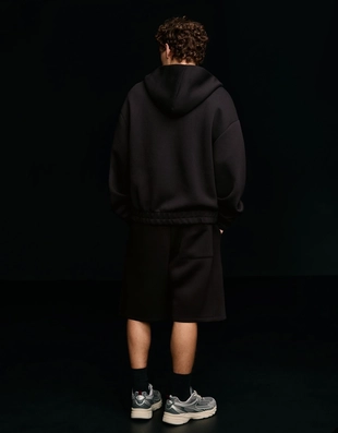 Шорты оверсайз из плотной синтетической ткани- Заказать в России