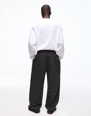 Объемные брюки свободного кроя с защипами- Заказать в России