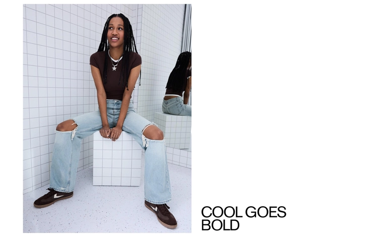 Джинсы свободного кроя с высокой посадкой и разрезами