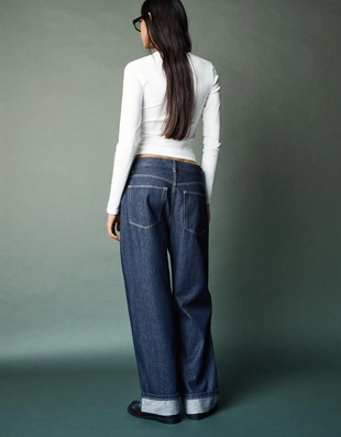 Джинсы свободного кроя с низкой посадкой и отворотами- Заказать в России