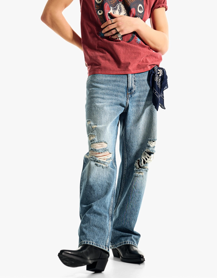 Джинсы с низкой проймой и разрывами