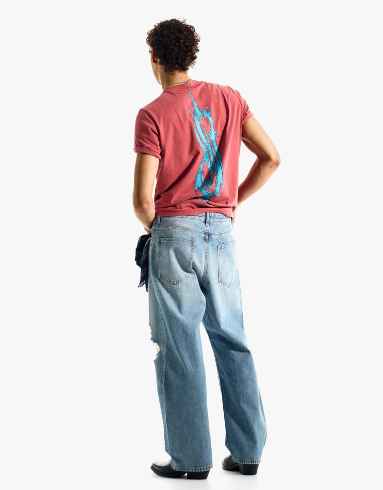 Джинсы с низкой проймой и разрывами