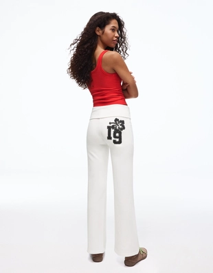 Расклешенные брюки из мягкой ткани с нашивкой- Заказать в России