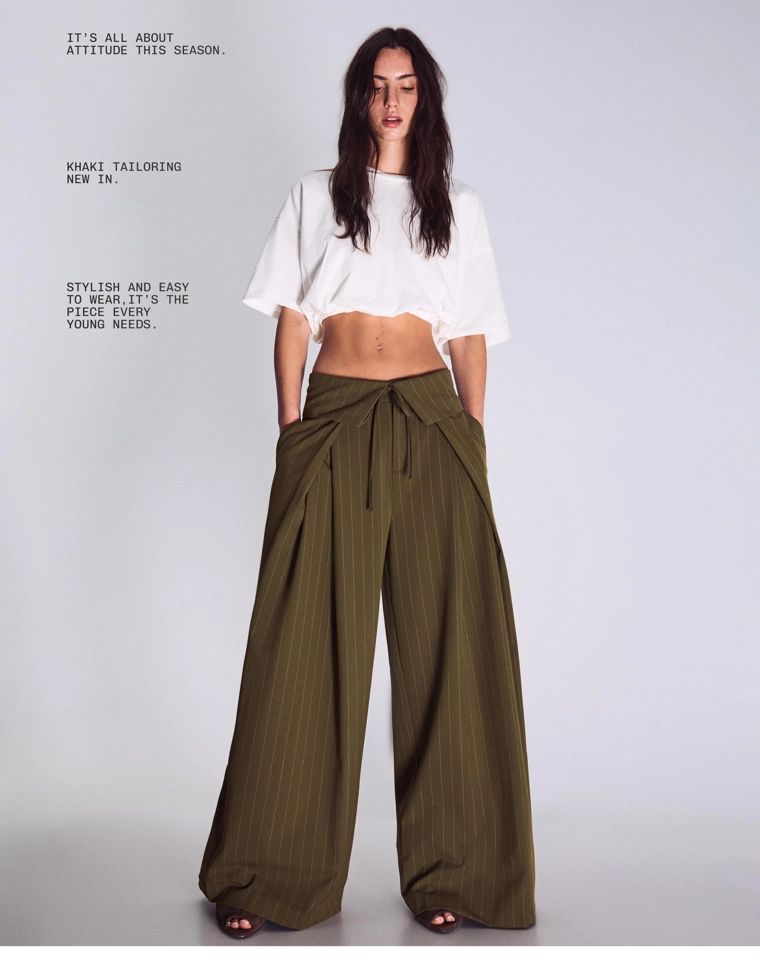 Брюки с защипами и отворотом на поясе