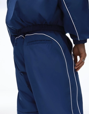 Высокотехнологичные объемные брюки свободного кроя- Заказать в России