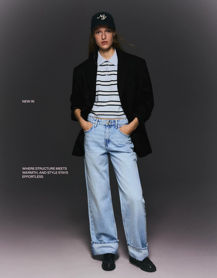 Джинсы прямого кроя с широкими штанинами и отворотами снизу