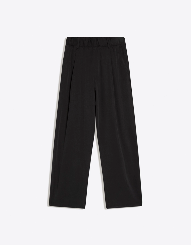 Объемные струящиеся брюки с защипами