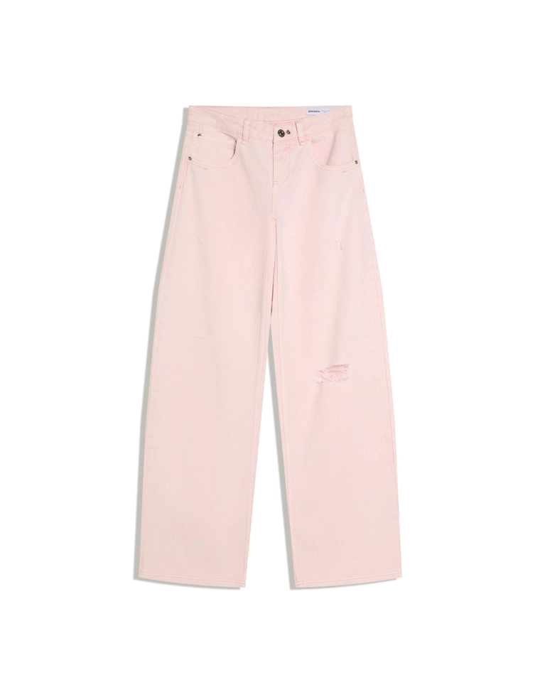 Брюки с эффектом потертости и разрезами