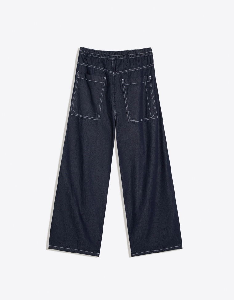 Джинсы с широкими штанинами и защипами