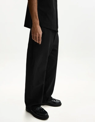 Джоггеры свободного кроя из плиссированной ткани- Заказать в России