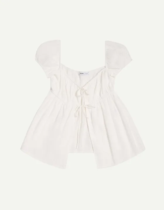 Топ из рельефной ткани с принтом и бантами