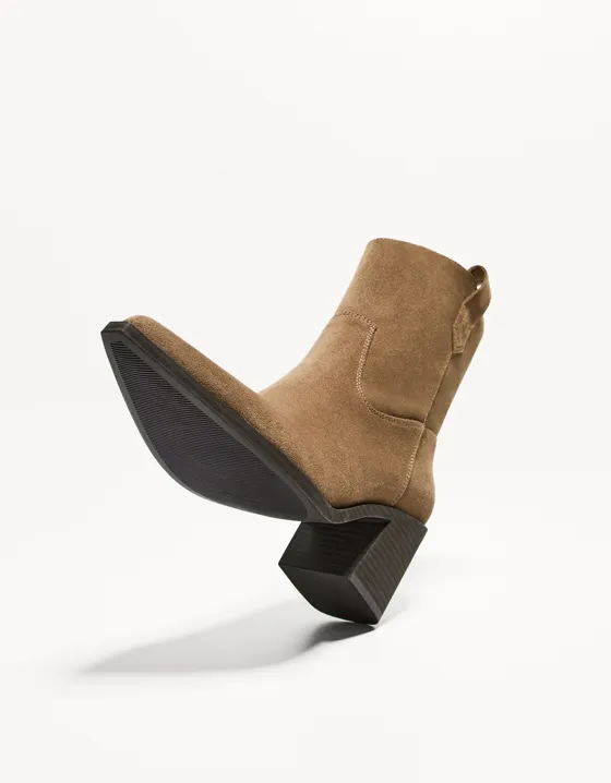 Asymmetric heeled cowboy ankle boots