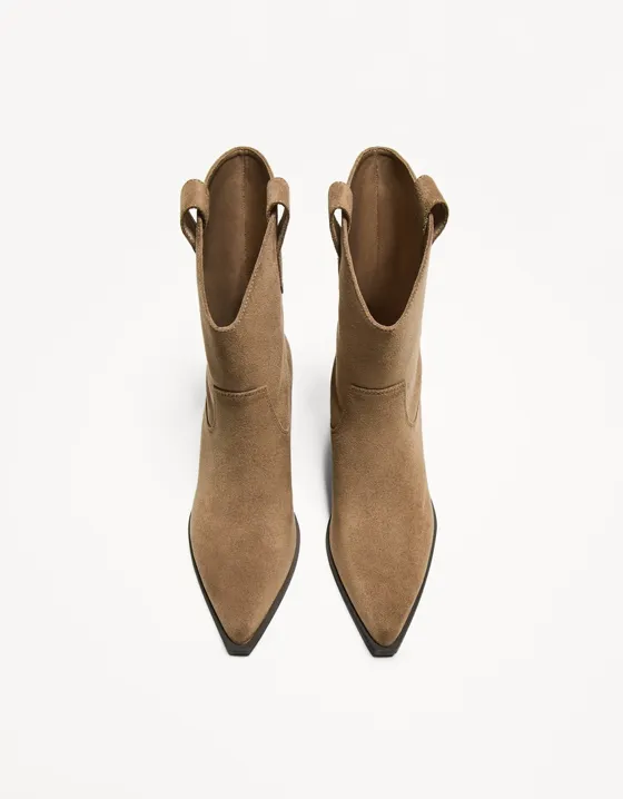 Asymmetric heeled cowboy ankle boots