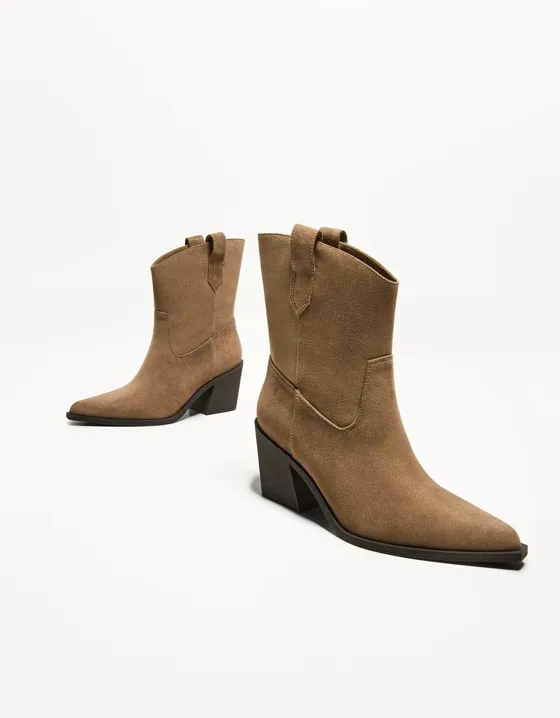 Asymmetric heeled cowboy ankle boots